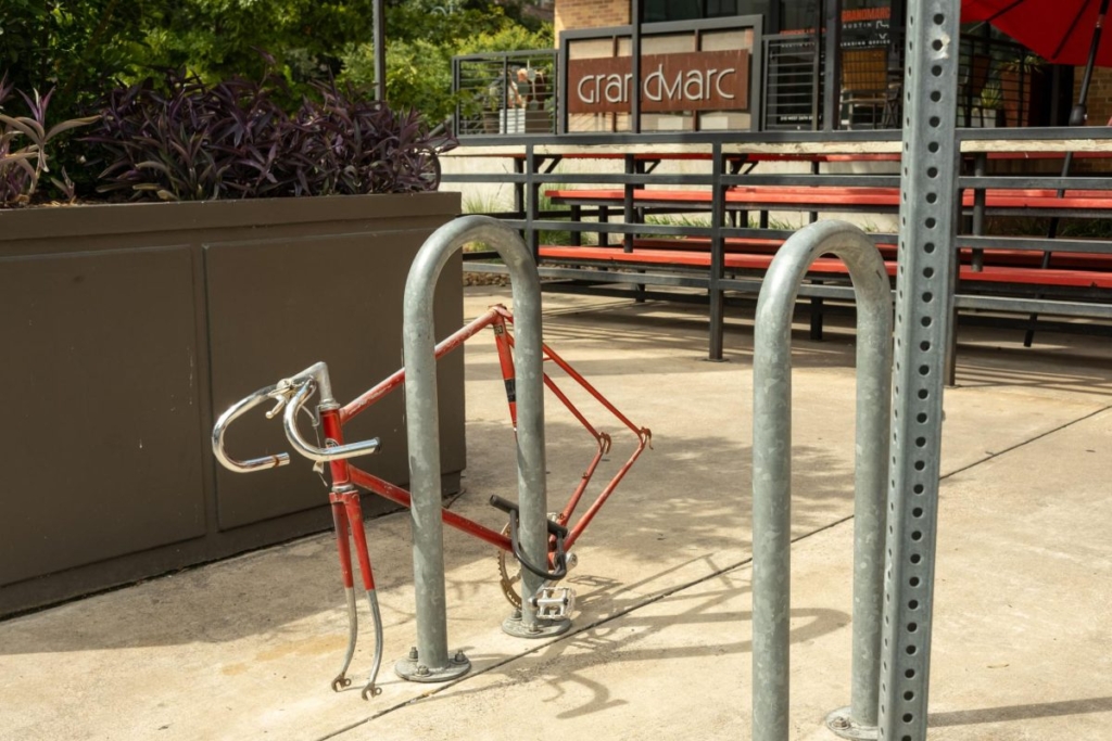 Bike frame with wheels missing attached bike rack