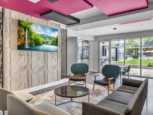 Modern colorful lounge area with door to outside courtyard