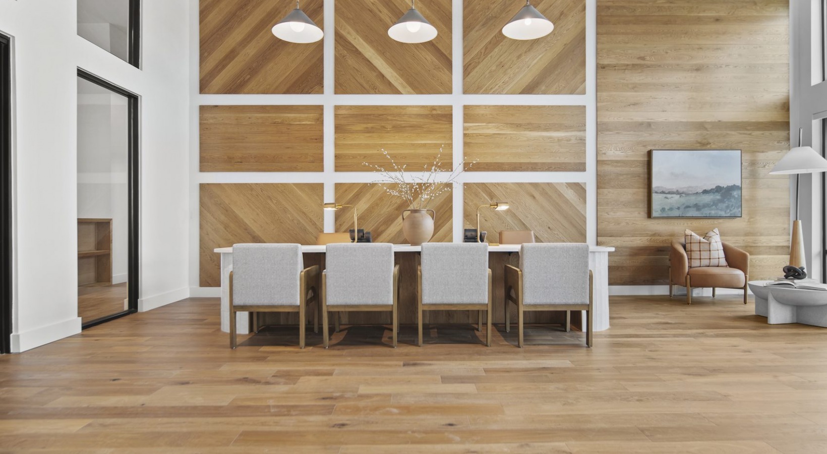 Modern office with wood floors and wood paneling
