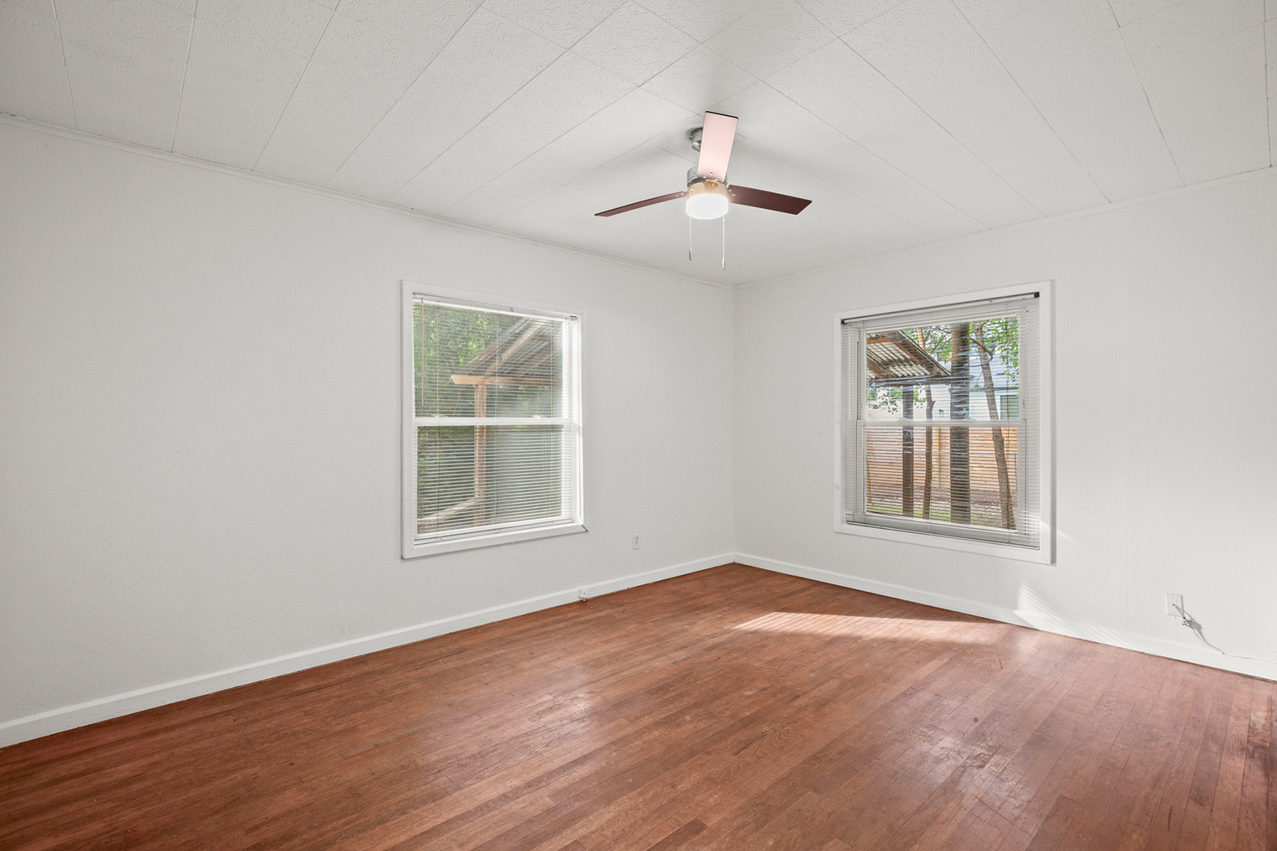 Room with windows and wood floor