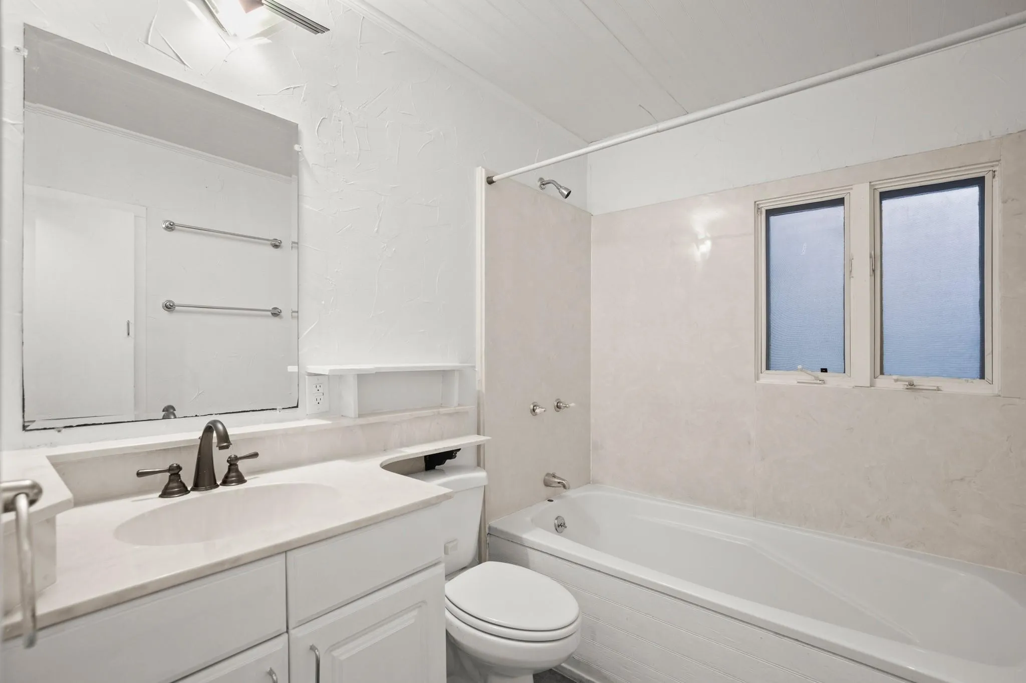 Full bathroom with vanity, shower / washtub combination