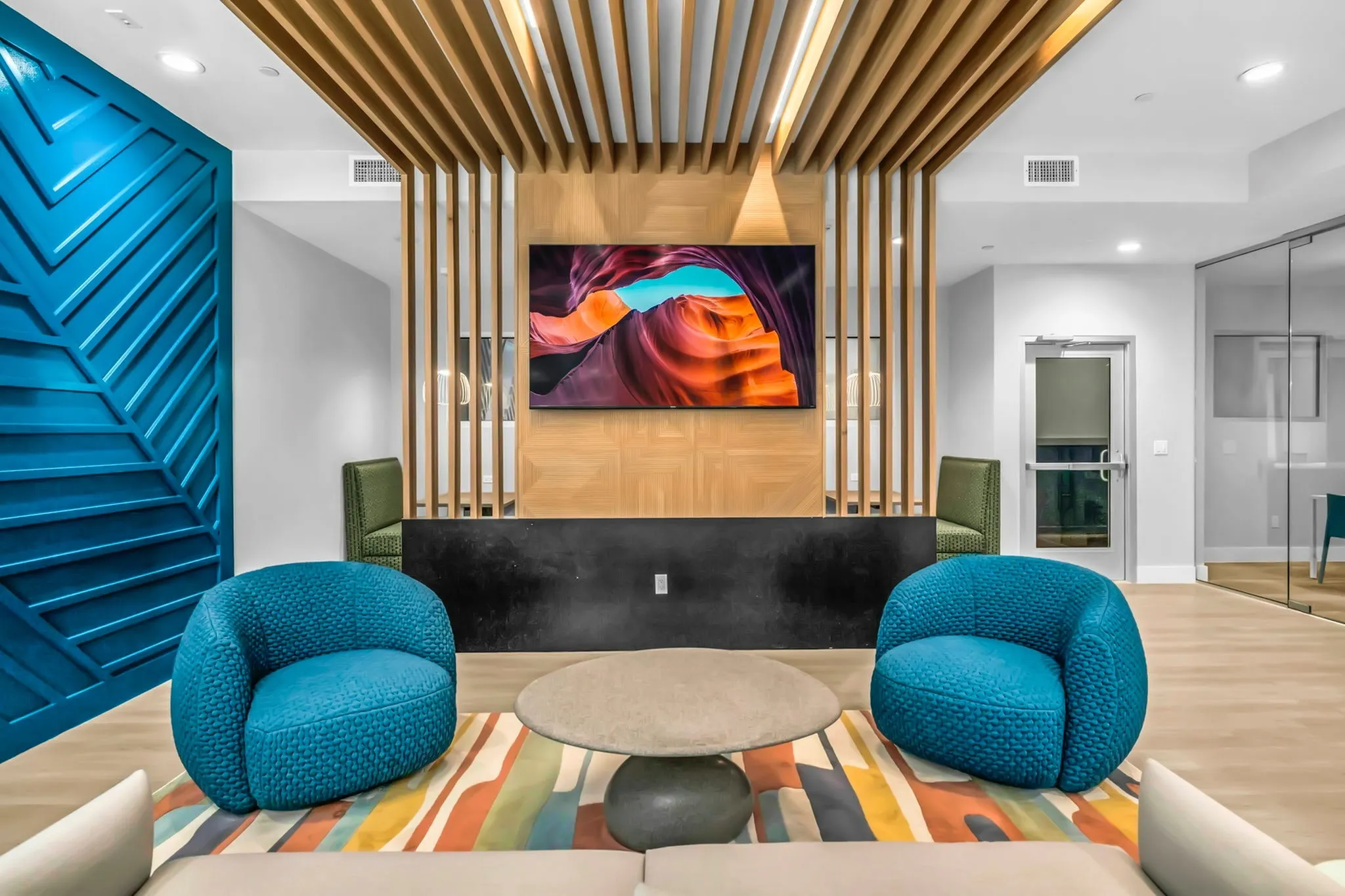 Lounge with chairs and TV